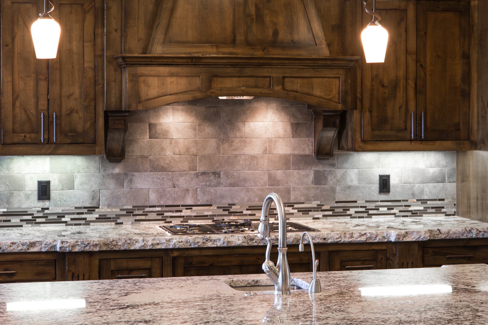 Knotty alder kitchen with custom range hood, Central Oregon