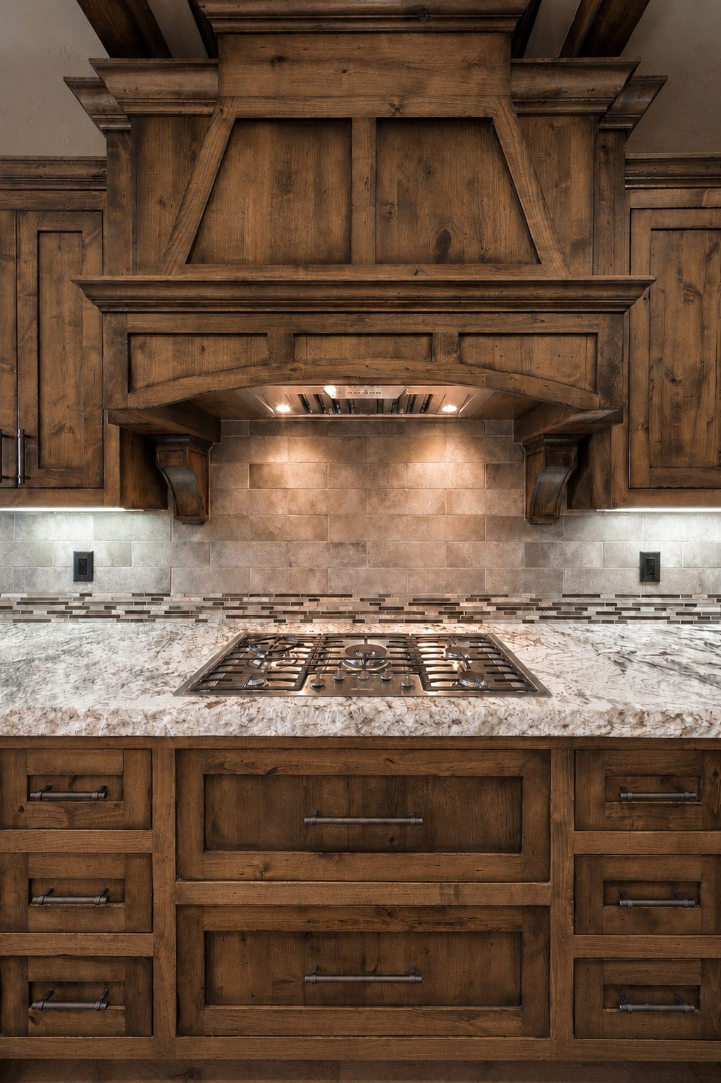 Knotty alder kitchen range hood over the cooktop, custom cabinetry in Bend, Oregon